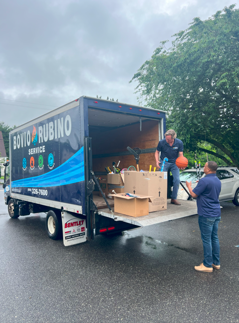 unloading sports equipment from a truck